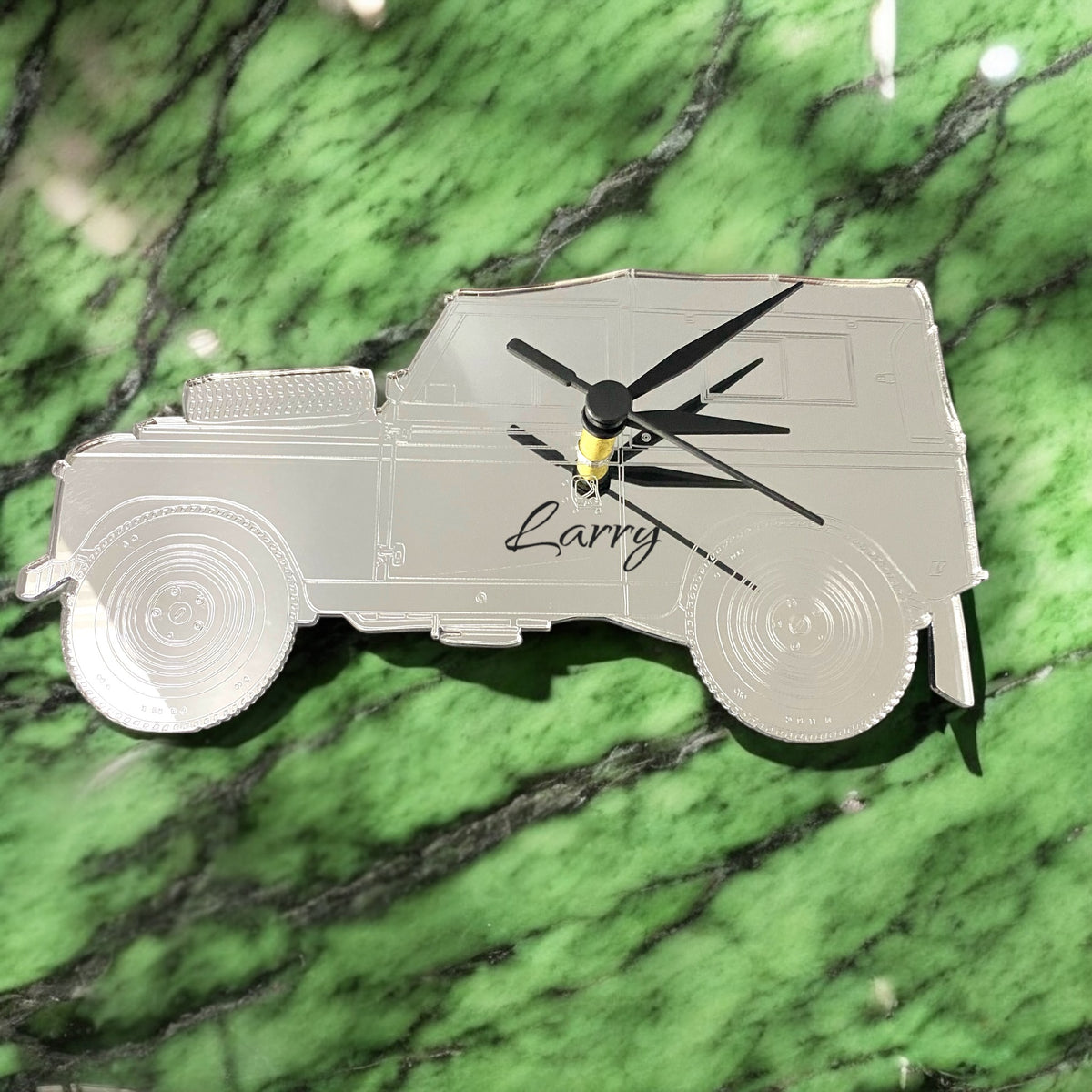 Silver mirrored SUV-shaped wall clock personalized with the name "Larry" in black script, featuring black clock hands.