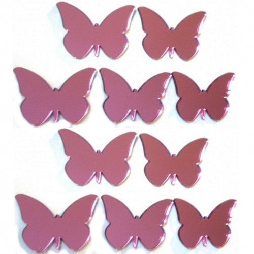 Ten pink acrylic butterfly mirror shapes in varying sizes arranged in rows.