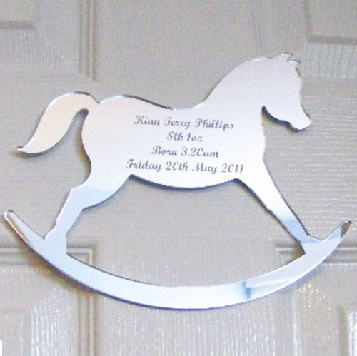 Silver rocking horse mirror engraved with birth details including name, weight, and date.