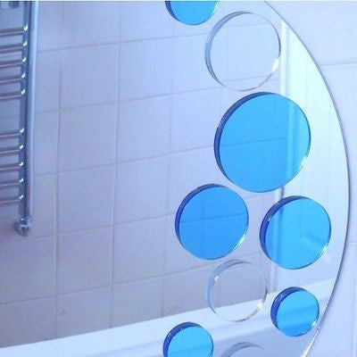 Round silver mirror decorated with blue and clear circular bubble accents along the right edge.
