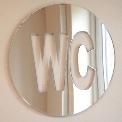 Round mirrored acrylic WC toilet sign with cut-out letters.