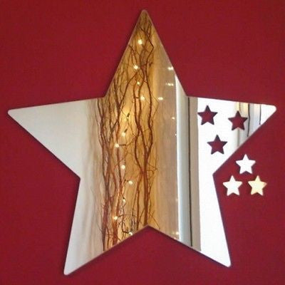 Star-shaped silver mirror featuring five small cut-out stars on the right side, mounted on a red wall.