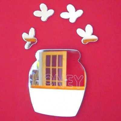 Honey pot and bee-shaped mirrors on a red background.
