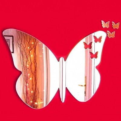 Butterfly-shaped wall mirror with smaller butterfly stickers flying out from the top right edge.