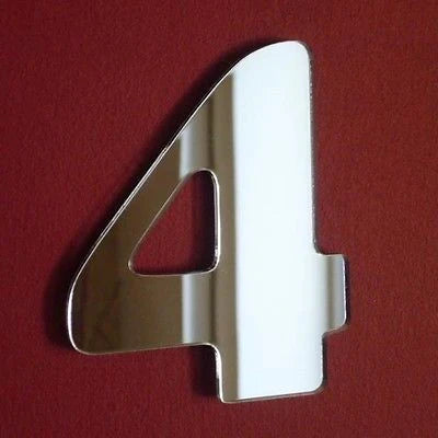 Silver mirrored acrylic number 4 shape against a dark red background.