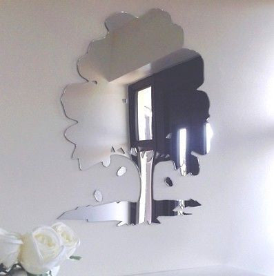 Oak tree and acorns shaped wall mirror mounted on a white wall.