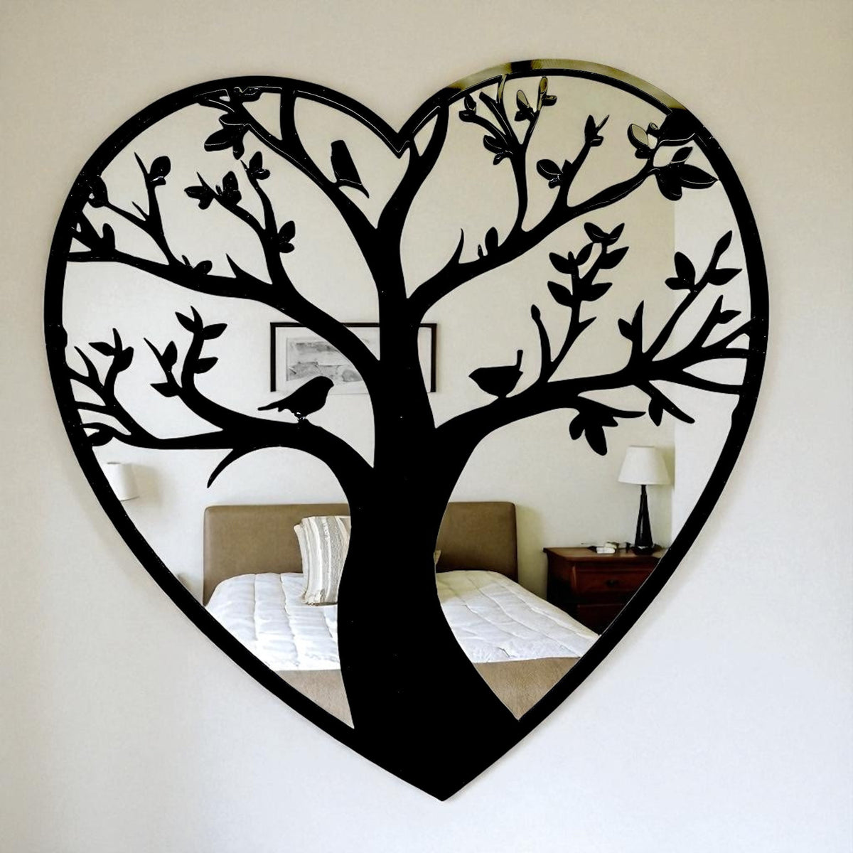 Heart-shaped mirror featuring a black metal Tree of Life overlay with birds.
