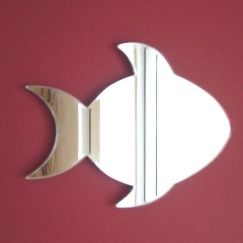 Silver fish-shaped wall mirror against a plain red background.