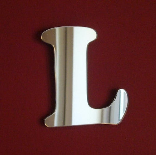 A silver mirrored letter L in a funky font on a dark red background.