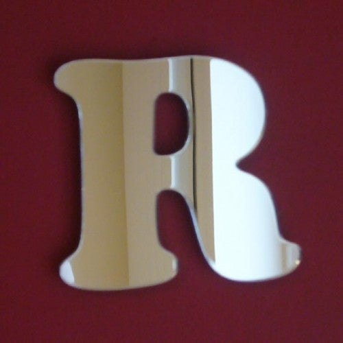 A reflective silver mirror shaped like the funky letter R.