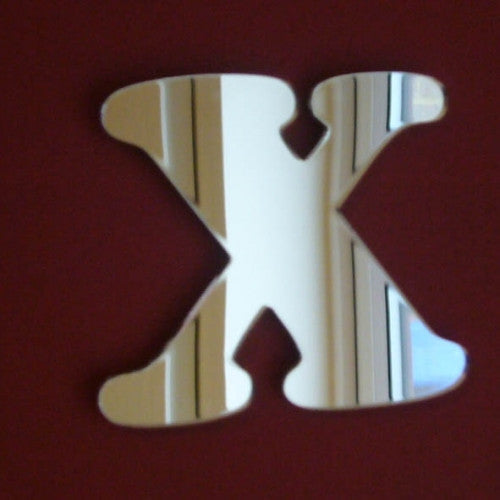 A reflective letter X mirror with a funky, stylized shape on a dark red background.