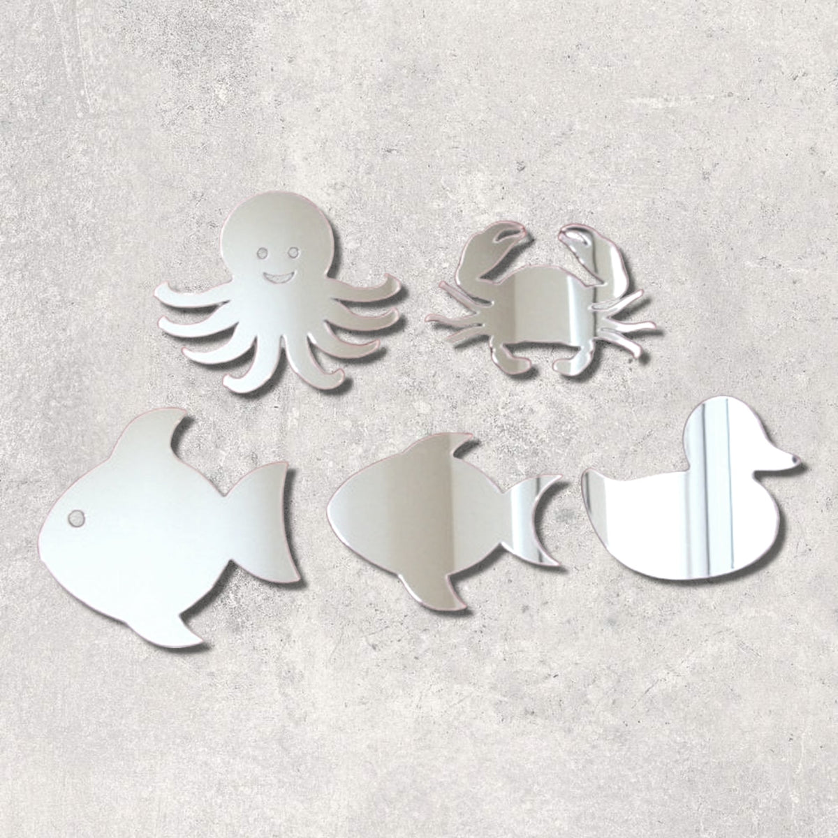 Bundle of five sea life-shaped mirrors including an octopus, crab, two fish, and a duck, on a gray wall.