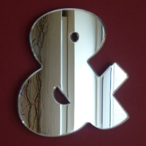Contemporary ampersand-shaped wall mirror with reflective silver surface.