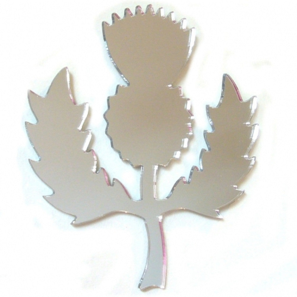 Scottish thistle-shaped acrylic mirror in silver, featuring jagged leaves and a flower head on a white background.