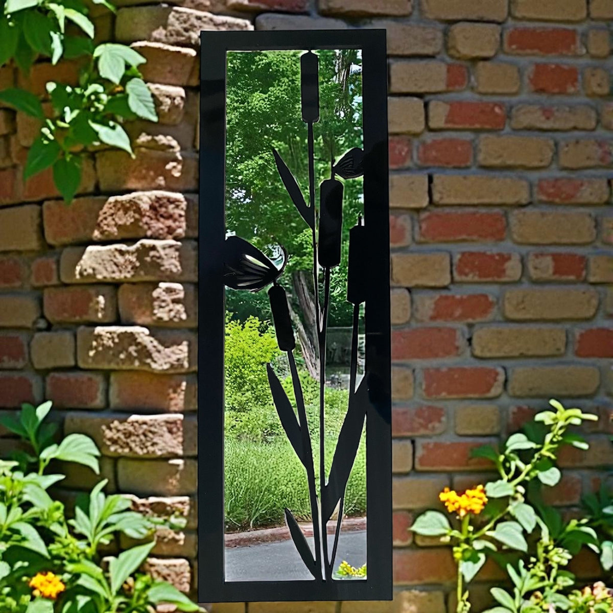 Rectangular black metal framed garden mirror featuring a cut-out bulrush and flower design.