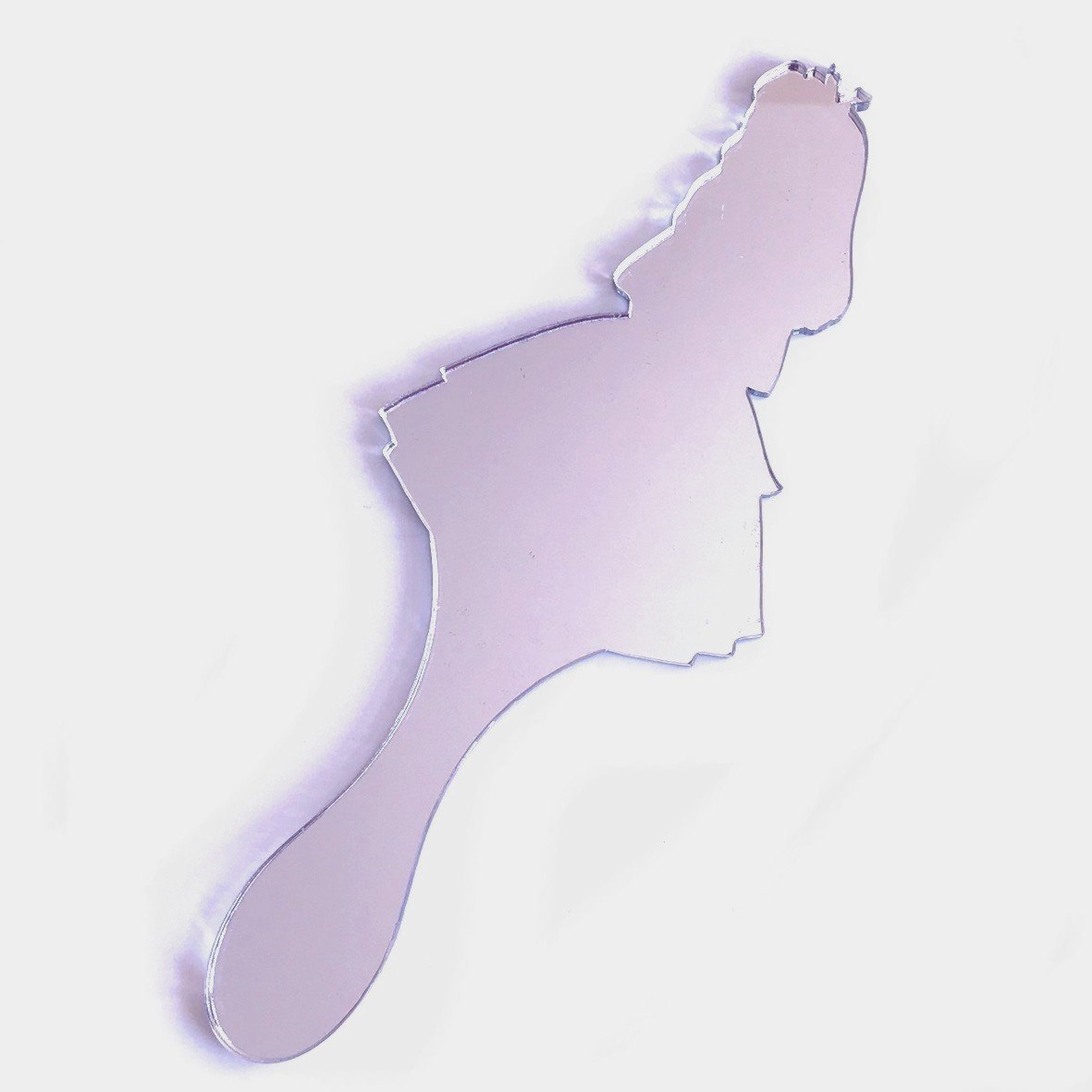 An Alice in Wonderland-shaped hand-held mirror with a long handle on a white background.
