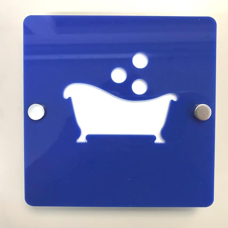 Square blue acrylic sign with white cutout of a bathtub and bubbles, secured with silver standoffs.