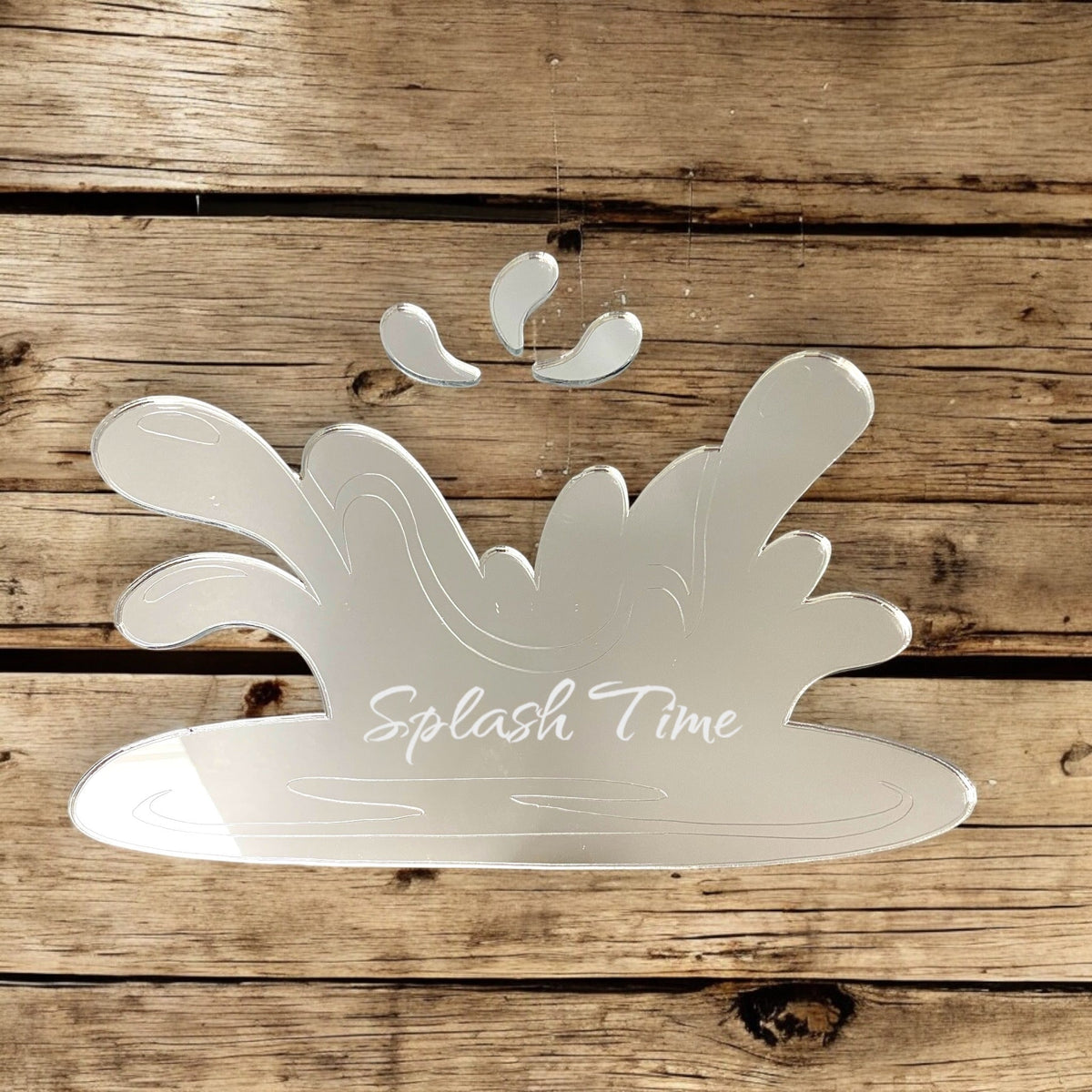Etched wave splash shaped mirror with "Splash Time" text on a rustic wooden background.