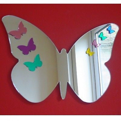 Butterfly-shaped mirror on a red wall, decorated with colorful small butterfly stickers.