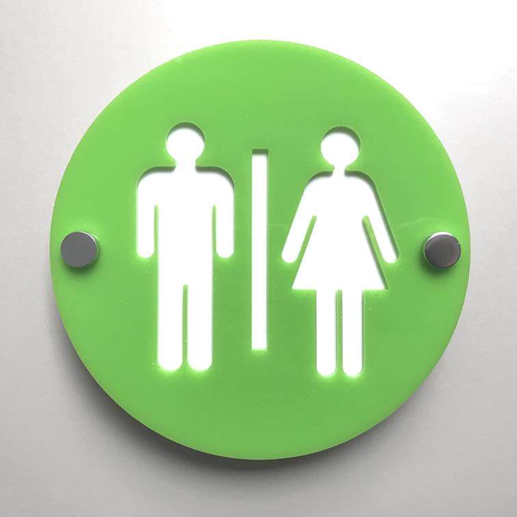 Round green floating male and female toilet sign with silver standoffs on a white wall.