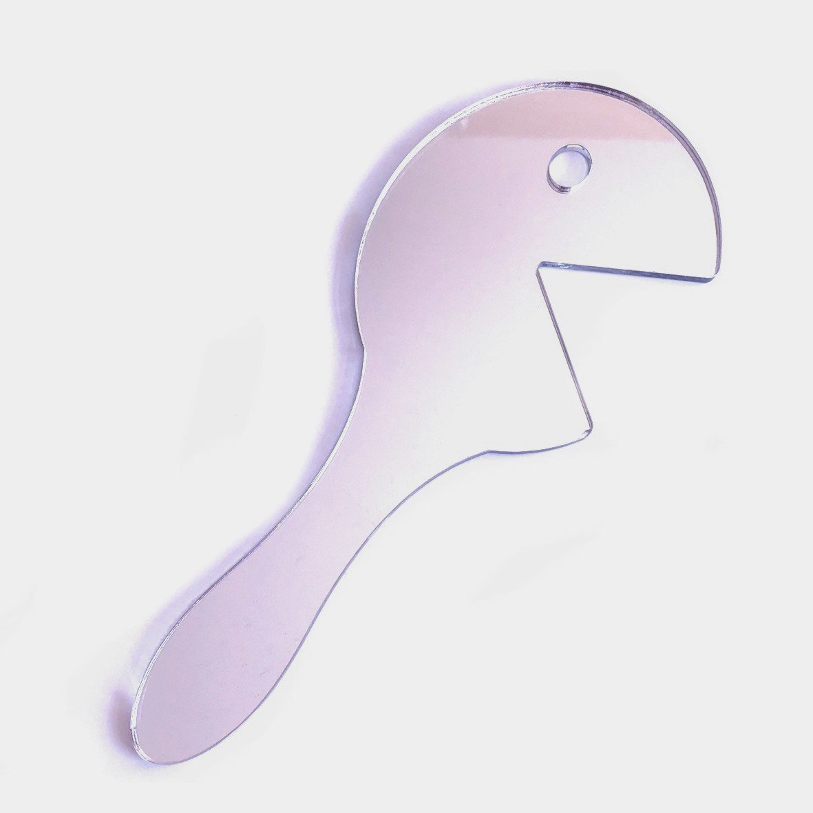 Hungry Man shaped handheld mirror with a reflective surface and a handle.