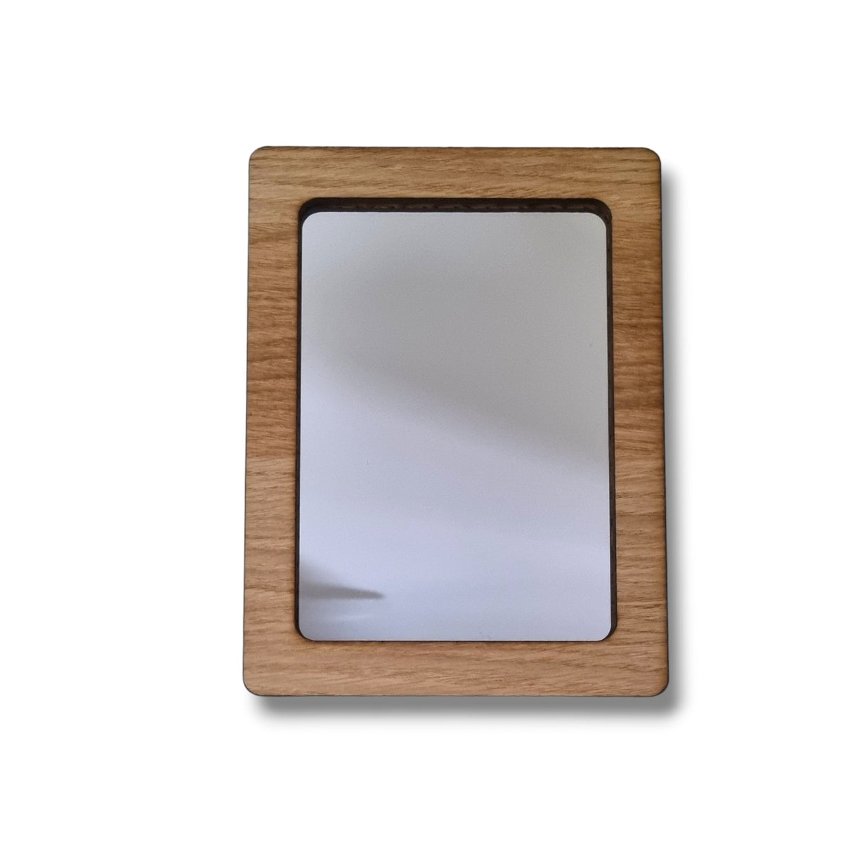 A rectangular mirror with a thick, light brown wood frame featuring a visible natural wood grain pattern.