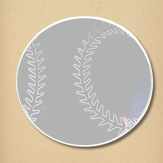 A circular baseball-shaped mirror with white printed seams against a tan background.