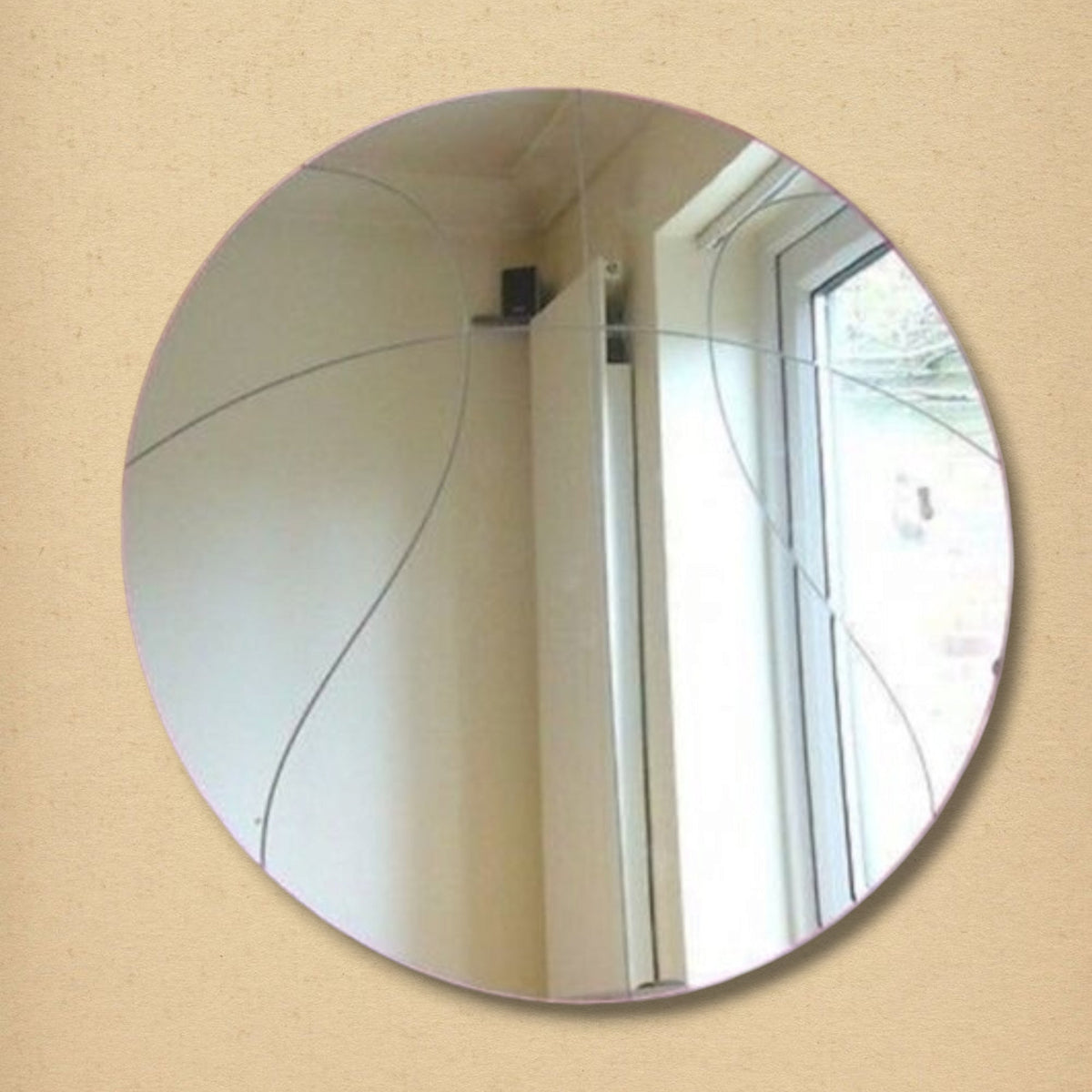 Round glass mirror with segmented curved lines forming a basketball pattern.