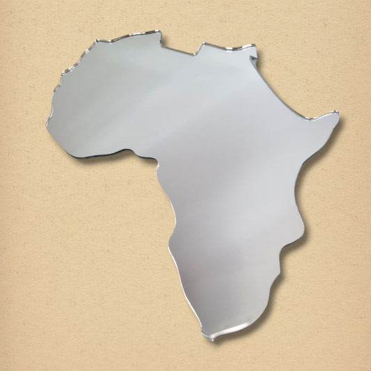 Silver Africa map-shaped mirror on a textured beige background.