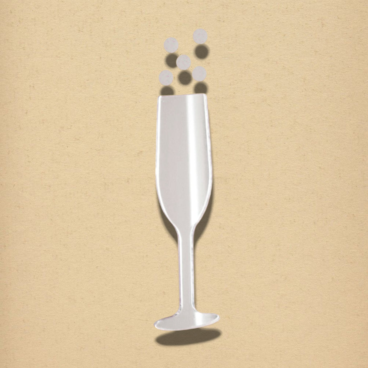 Champagne flute and bubbles shaped mirror set in silver against a neutral tan wall.