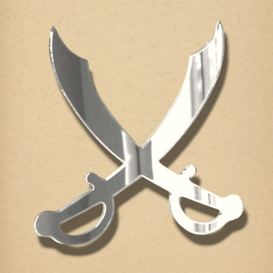 Silver mirrored acrylic wall art shaped like two crossed cutlass swords with ornate hilts on tan background.