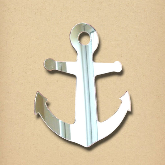 An anchor-shaped reflective mirror on a tan textured background.