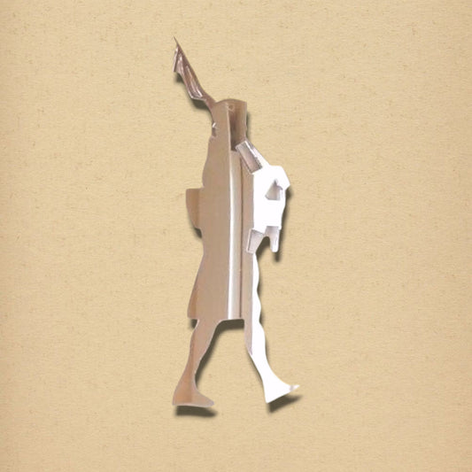 Silvery, bagpipe player-shaped mirror on a textured tan background.