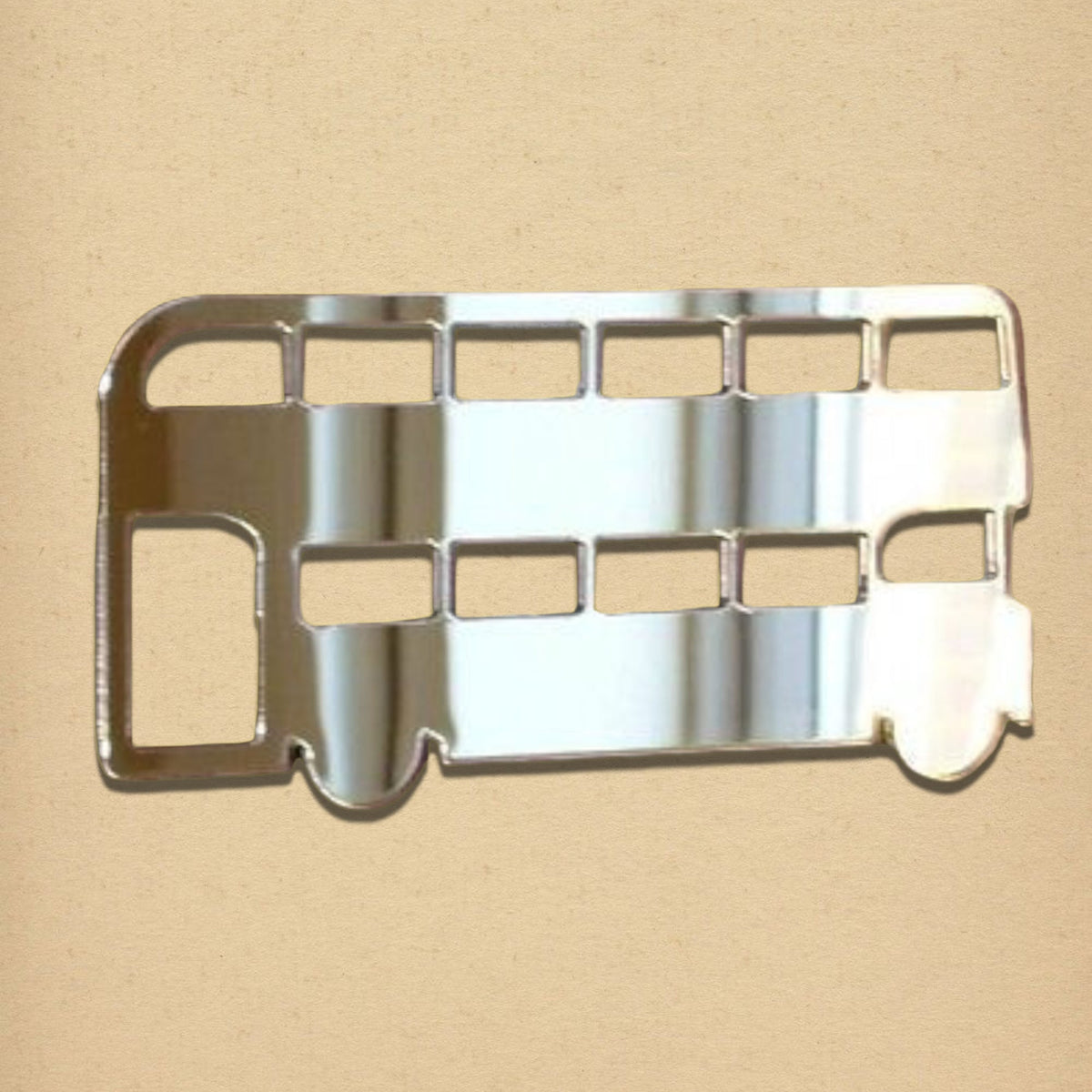 Silver double-decker bus-shaped mirror with cutout windows and wheels.
