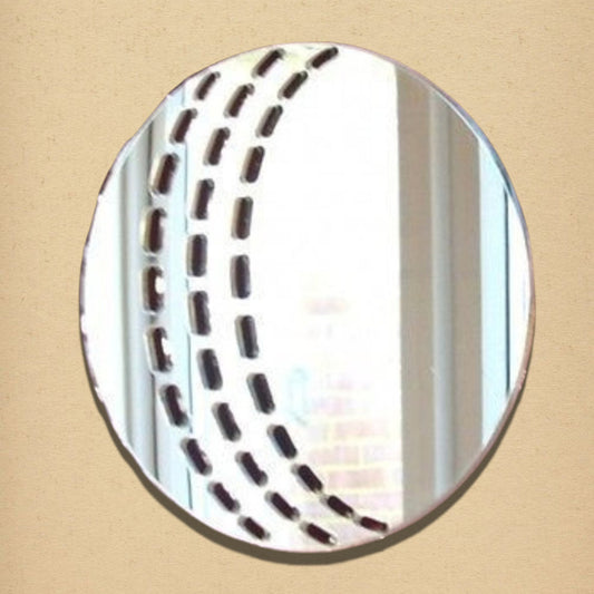 A circular mirror shaped like a cricket ball, featuring etched curved seams of dashed lines.