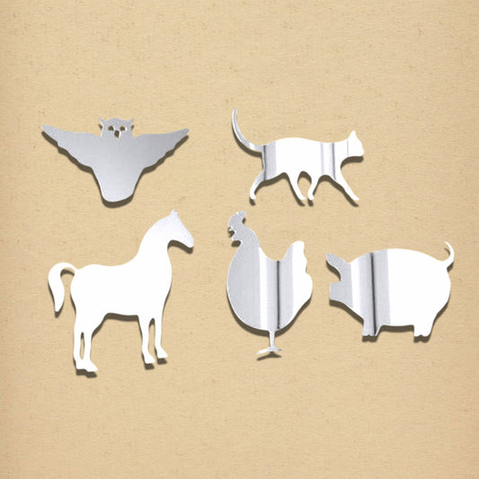 Four silver acrylic mirrors shaped like farm animals: an owl, cat, horse, rooster, and pig against a tan background.