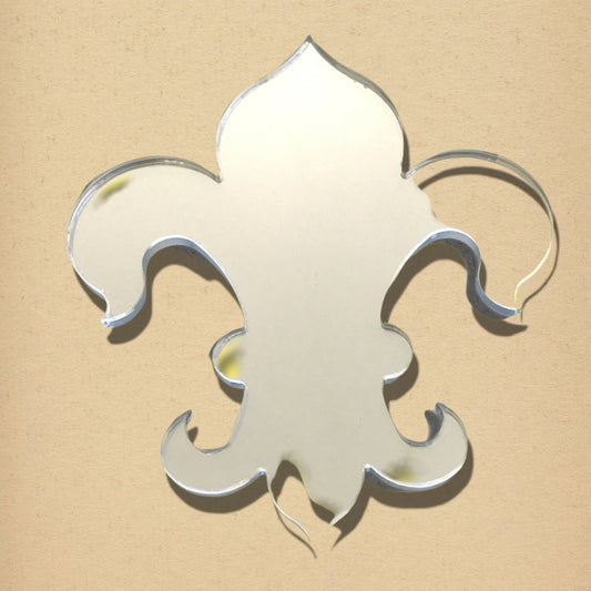 Fleur de Lys shaped mirror with beveled edges on a neutral tan background.