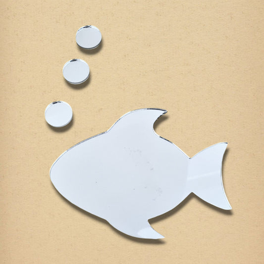 Fish and three circular bubble mirrors in silver, arranged on a beige background.