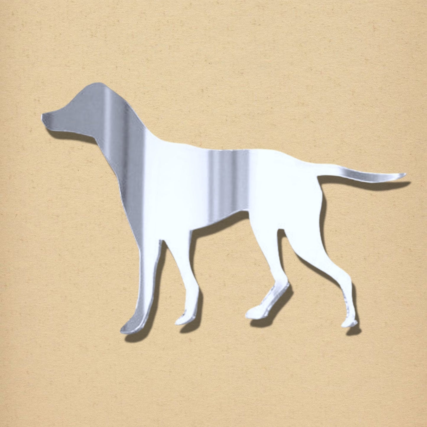 Silver mirror in the shape of an English Pointer dog against a neutral background.