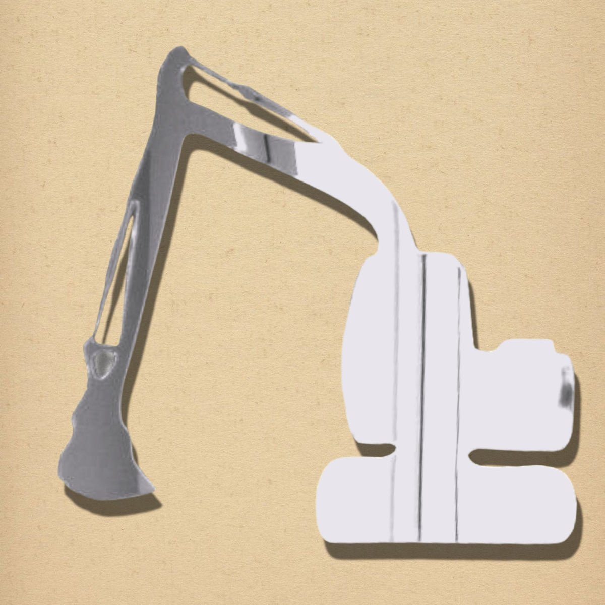 Silver mirror shaped like an excavator on a tan background.