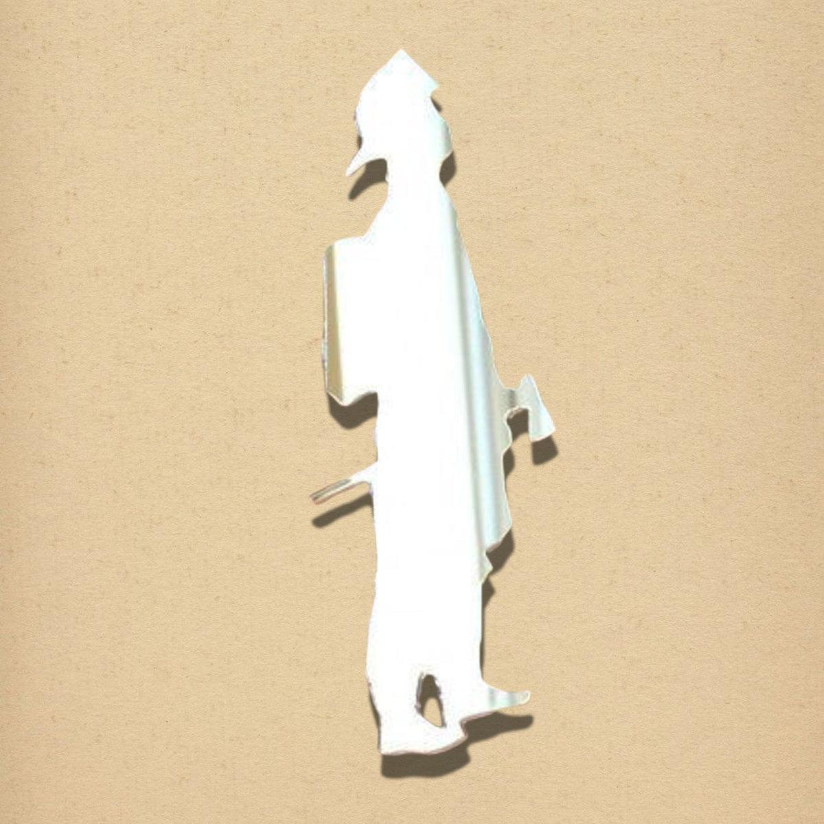 Silver fireman-shaped mirror on a textured beige background.