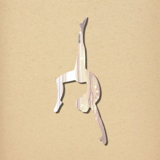 A gymnast-shaped wall mirror with a reflective surface, posed in a handstand.