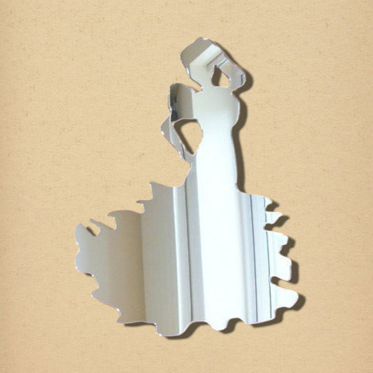 A reflective acrylic wall mirror shaped like a silhouetted flamenco dancer in a ruffled dress.