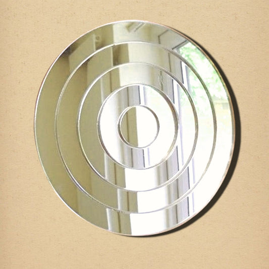 A round wall mirror with concentric circular bevels creating an infinite tunnel effect.