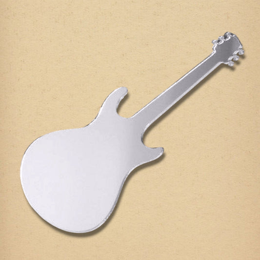 Silver electric guitar-shaped mirror on a textured tan background.