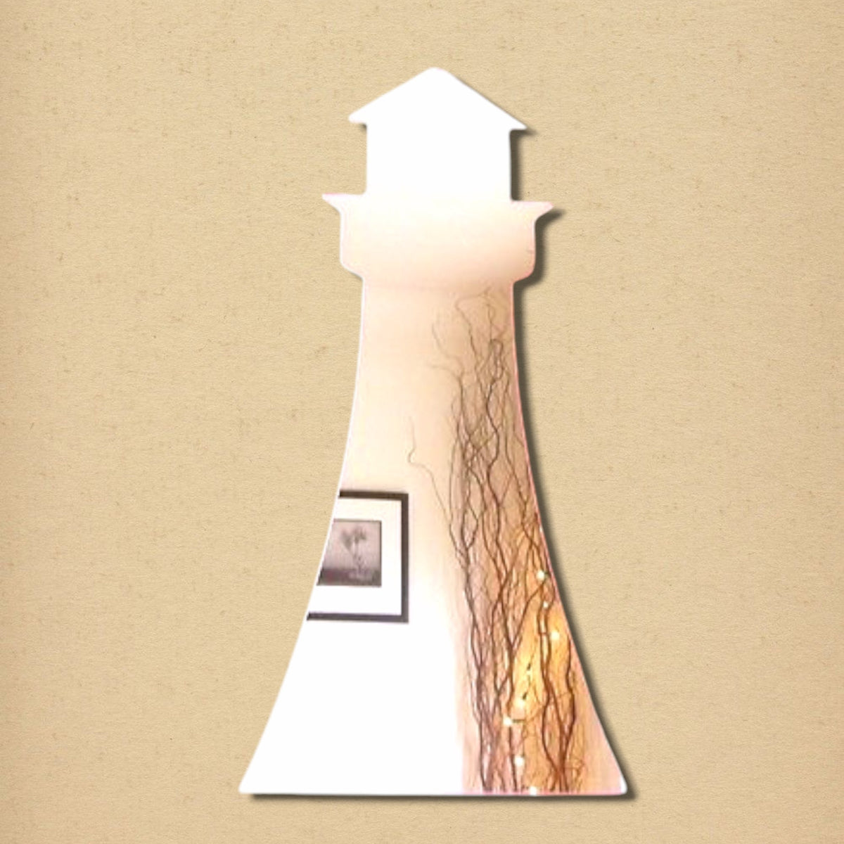 A lighthouse-shaped wall mirror with a tapered body and top lantern room design on a textured beige background.