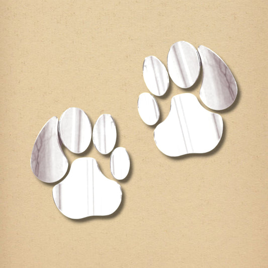 Two silver acrylic lion paw print wall mirrors on a neutral beige background.
