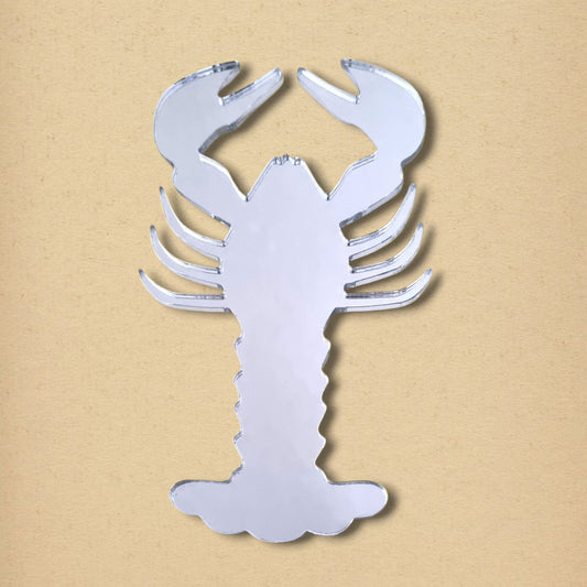 Lobster-shaped silver mirror on a light textured background.