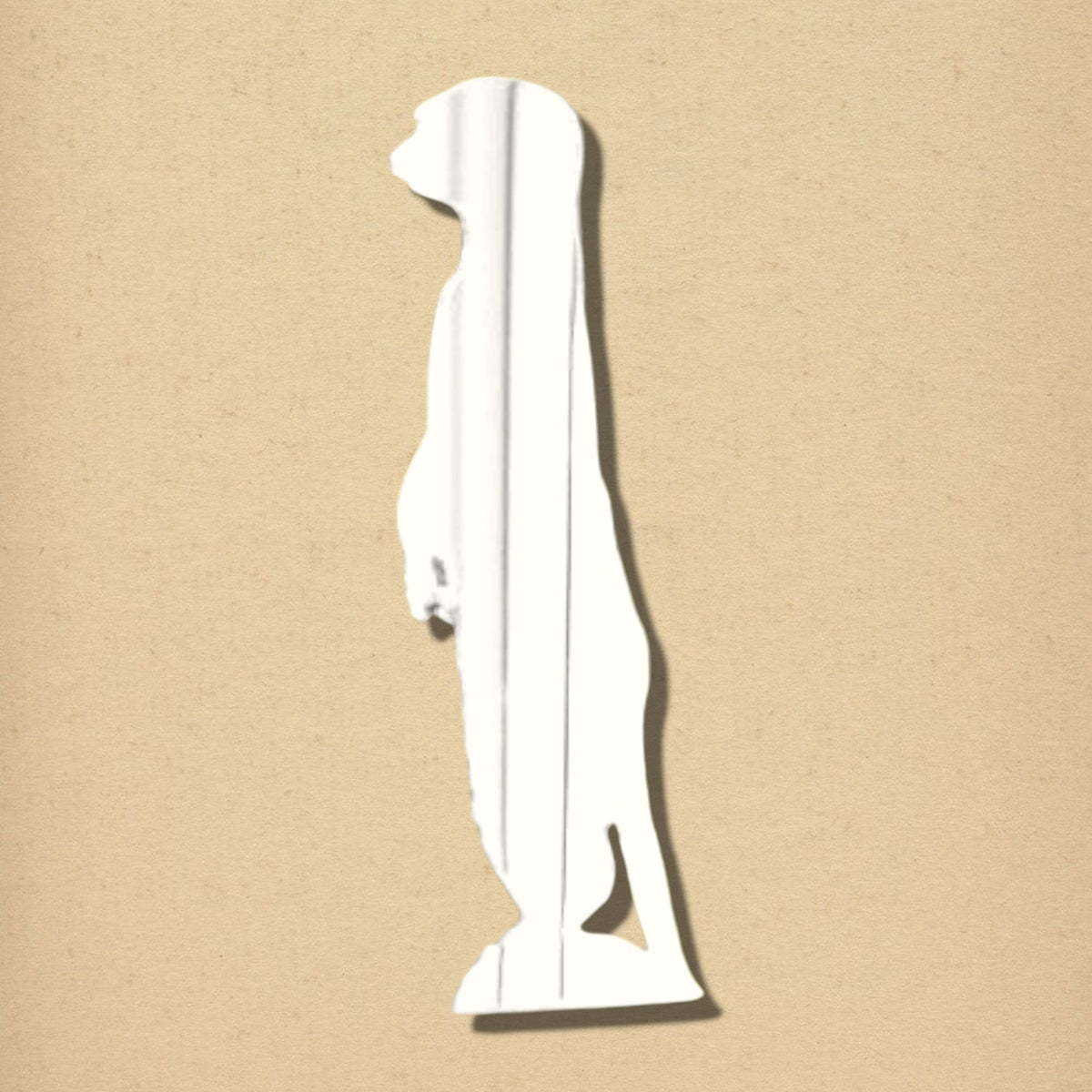 Meerkat-shaped wall mirror with a reflective surface, standing upright on a plain beige background.