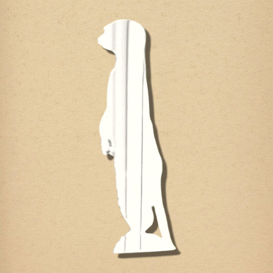 Meerkat-shaped wall mirror with a reflective surface, standing upright on a plain beige background.